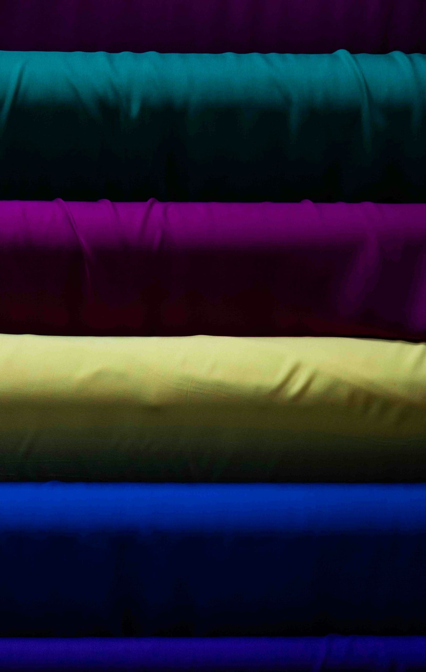 BOLTS OF FABRIC IN BOLD COLORS THE CHOICES ONE CAN MAKE WHEN DOING TEAM BRANDING KEEPING IN THE SERATE FOR THRHJ